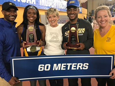: Two-time All-American Karmin Shute and National Champion Jamal Watkins with (from left) Head Coach Kenneth Cox, BSC President Linda Flaherty-Goldsmith, and Athletic Director Kyndall Waters ’05. 
